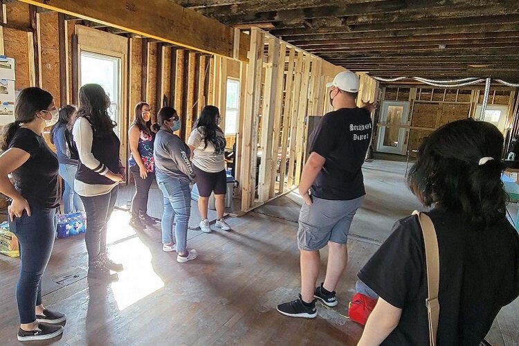 Young people with CoC check out the progress on building their new Youth-Driven community center.