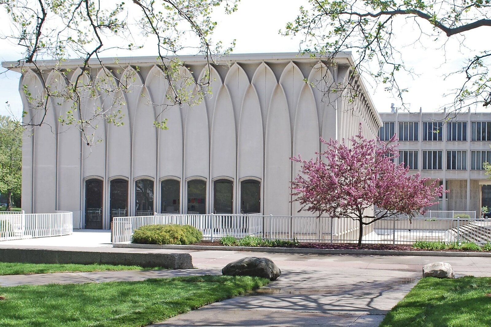 The Helen L. DeRoy Auditorium on the campus of Wayne State University and its surrounding reflection pool, seen here empty to the right of the building's foundation.