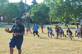 LifeBUILDERS youth play football with DeAngelo Mabone prior to the pandemic.