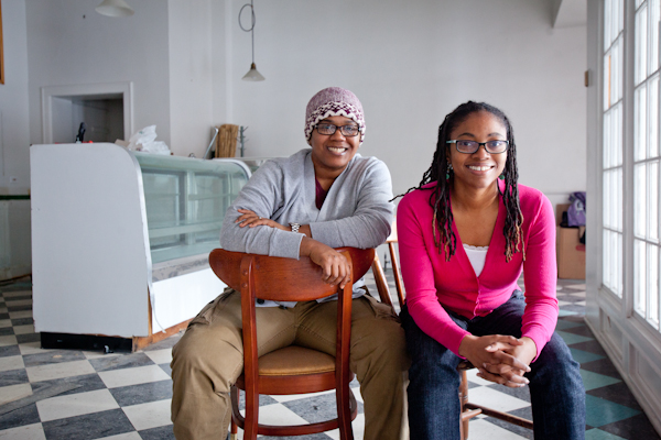 Erika Boyd and Kirsten Urssery sit for a portrait in what will soon be Detroit Vegan Soul 