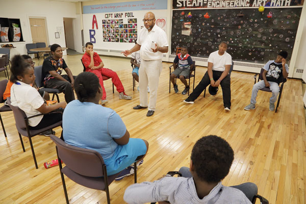 Frank McGhee talks to a group of students