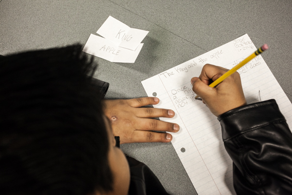 A young writer at work during an 826Michigan workshop at the Campbell Branch Library