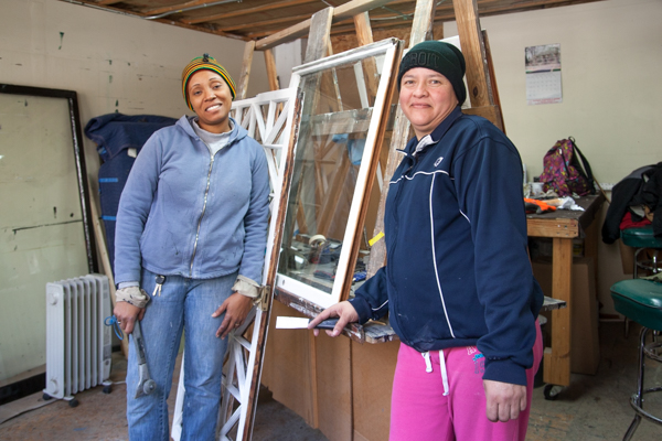 Guisa Suttle and Maria Fernandez glazzing and fitting glass at Turner Restoration's workshop