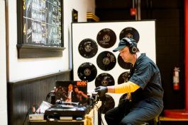 A Third Man worker selecting a record to play for the production floor