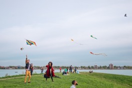 Attendees of a kite pop-up on the riverfront