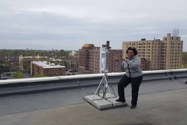 Monique Tate shows off the wireless technology on the roof of WNUC