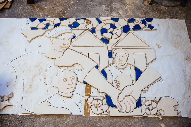 Creating the "Hands of Happiness" mural for Hubert Massey leads locals in creating a mural for Ella Fitzgerald Park