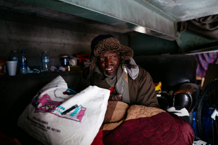 Curtis Farr, 58, has been living under the pedestrian bridge (the opposite side from Loy) for over a year. Carpenter put in an order at a pharmacy for his high blood pressure medication.