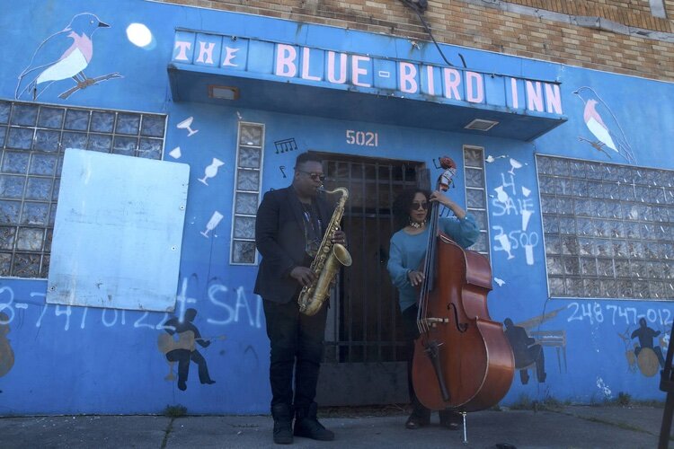 Bassist Marion Hayden and Saxophonist De’Sean Jones perform outside the Blue Bird Inn April 24, 2019 on the day of the ceremonial lock cutting after Detroit Sound Conservancy purchased the Blue Bird Inn.