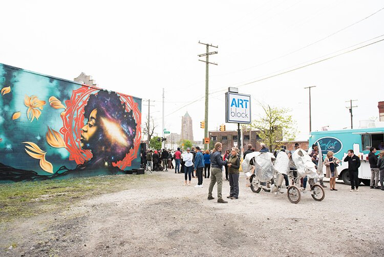 Artists, HFHS employees, and neighbors attend ArtBlock's opening day last spring.