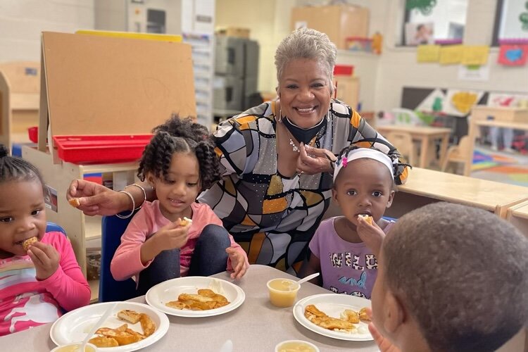 COTS' CEO Cheryl P. Johnson serving children in the COTS community.