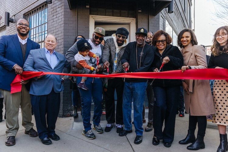 Detroit's Crawford family celebrates the grand opening of Cred Cafè in the Rivertown district.