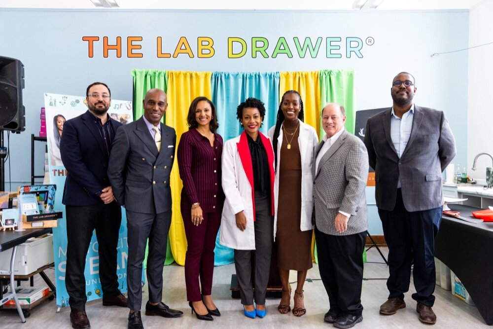 From Left: Motor City Match Program Director Andrew Lucco, Kevin Johnson, President & CEO DEGC, City Council President Mary Sheffield, Lab Drawer owners Dr. Alecia Gabriel and Dierdre Roberson, Mayor Mike Duggan, Sean Gray, DEGC VP of Small Business.