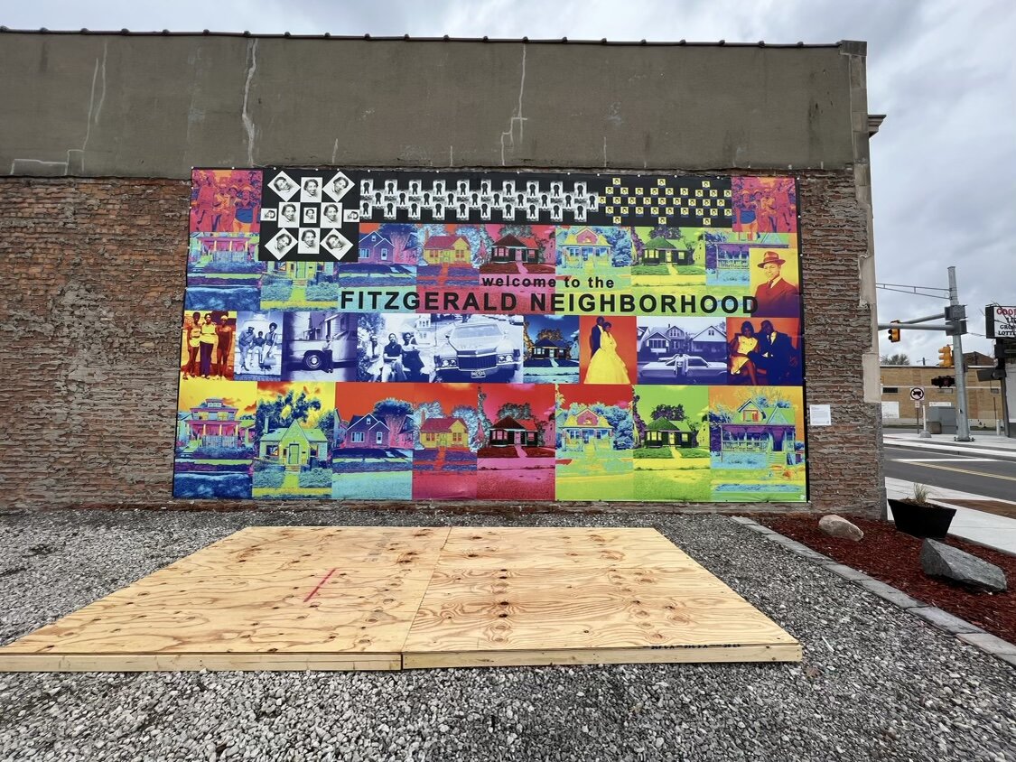 A new platform is laid out in front of the Fitzgerald neighborhood sign as the Live6 Alliance readies their pocket park for warm weather programming. Neighboring business Metro Detroit Barber College owns and volunteers use of the once vacant lot.