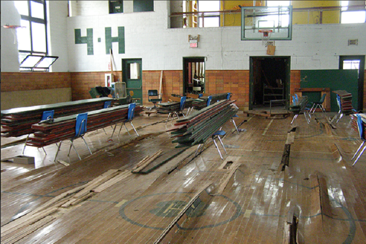 Brighter Detroit gym floor before renovations.