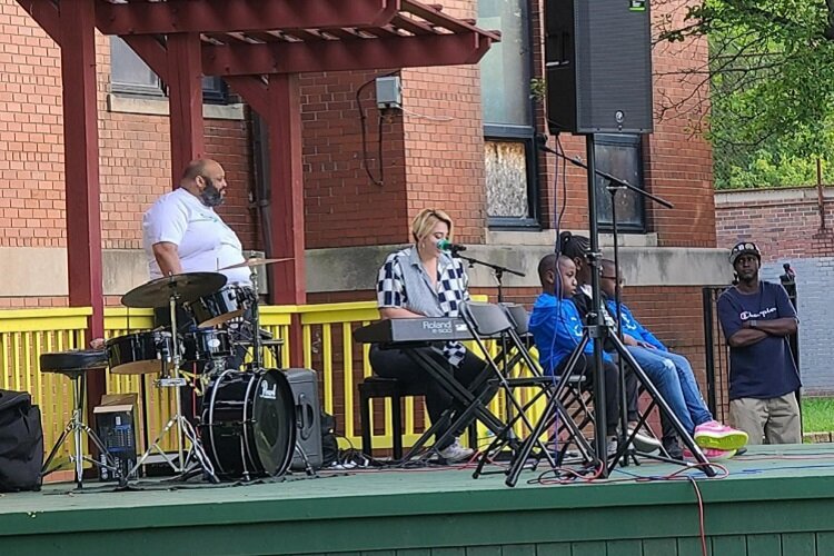 A band performs on Brighter Detroit's outdoor stage.