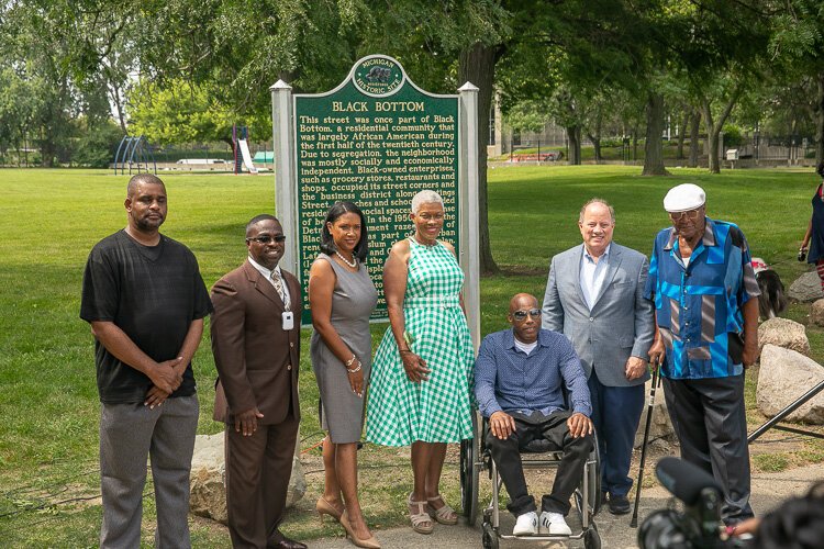 A distinguished panel including Commissioner Robin Terry of the Michigan Historical Commission dedicated the marker
