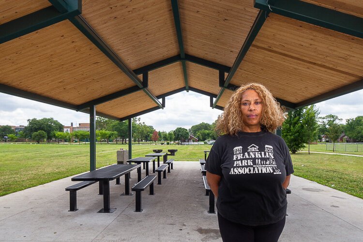 Bobbi Johnson of  Franklin Park Community Alliance stands in front of the park's new pavilion.