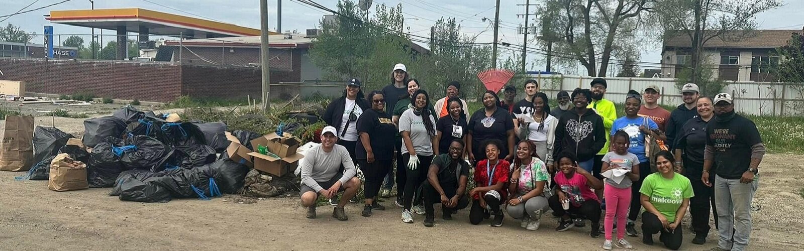 CRCAA volunteers clean up the future site of the organizations senior housing development.