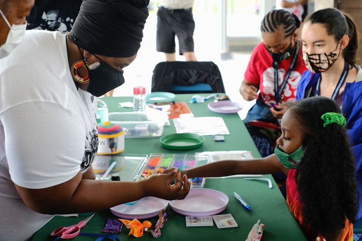 Participants create memorial pouches for the Healing Memorial.