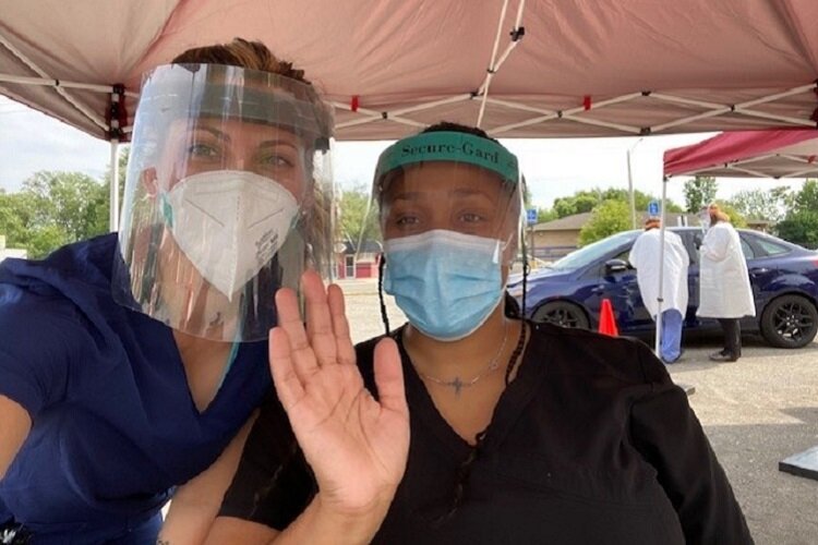 Covenant staff handle curbside testing at their Joy Rd. clinic.