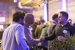 Michigan Founders Fund Member Mykolas Rambus, Co-Founder and CEO of Hush, shakes hands with Chase Lee, Founder and CEO of Trustpage at an MFF event in March
