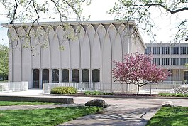 The Helen L. DeRoy Auditorium on the campus of Wayne State University and its surrounding reflection pool, seen here empty to the right of the building's foundation.