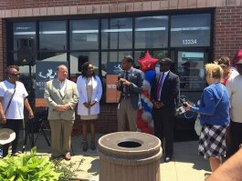 Officials from the city and Motor City Match celebrate at the grand opening of Diamond Smiles. Dentist Aisha Akpabio won a Motor City Match space award, which helped her secure the building, and a $65,000 cash grant from MCM.