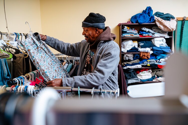 Don Lamarr, 64, looks through free clothing at FORC after getting out of prison a little over a year ago.
