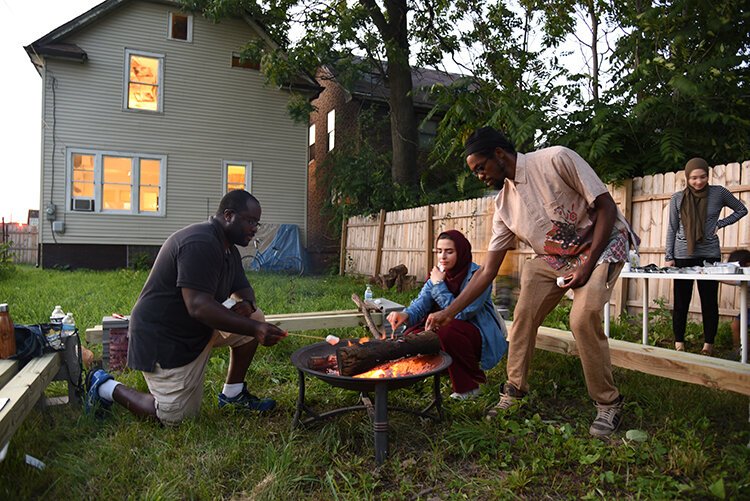 After an event for Detroit Art Week in July, people enjoy a campfire at Indus Detroit gallery space with halal s'mores.  Panelist Haleem "Stringz" Rasul from Hardcore Detroit takes part in the bonfire and smores. 
