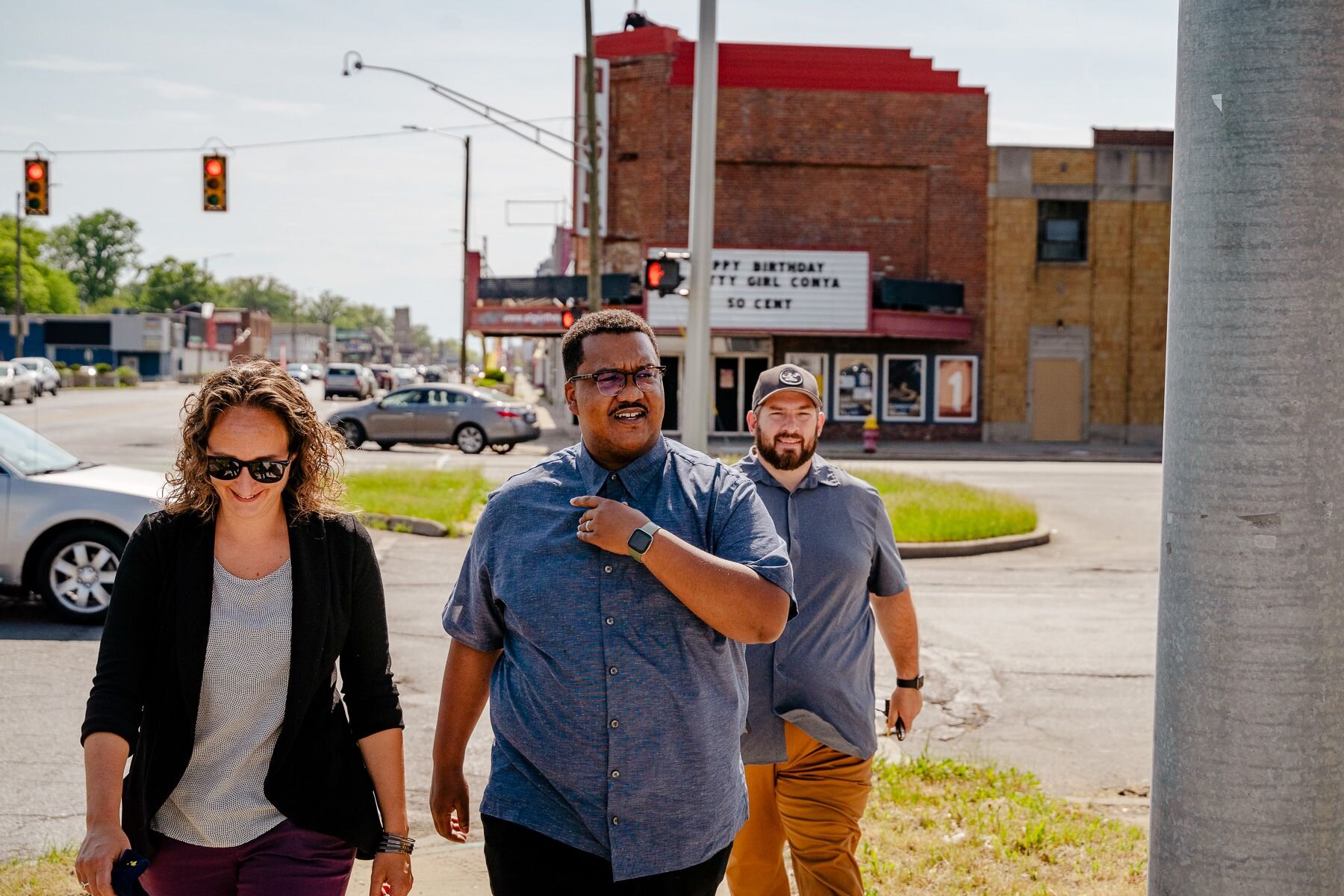 Anna Shires, with FHLBank Indianapolis, at front, walks with Jermaine Ruffin, with the city of Detroit, and Joe Rashid, with the East Warren EDC.