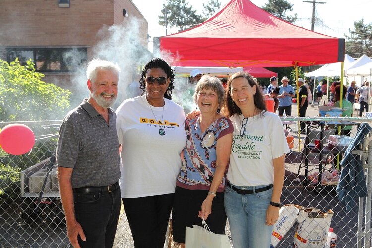 Local residents pose (pre-pandemic) during GRDC's annual farmers market.