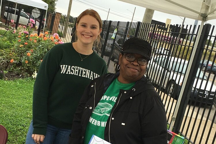 Juanita Maxwell (right) helps out at the HOPE Village Farmers Market.
