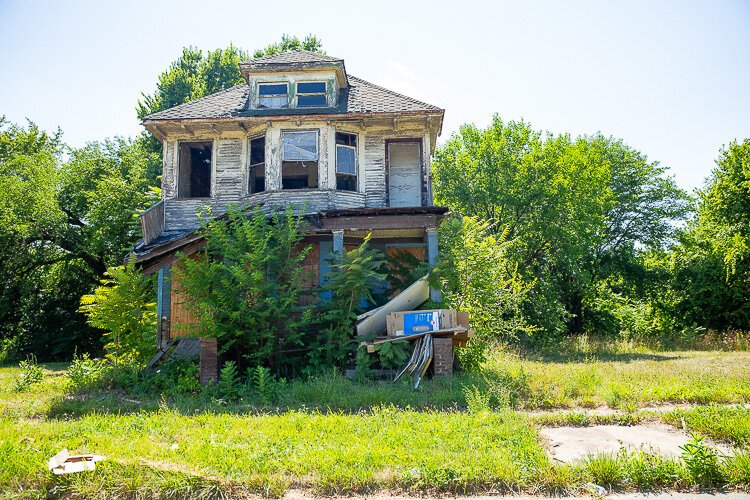 An abandoned house cluttered with trash.