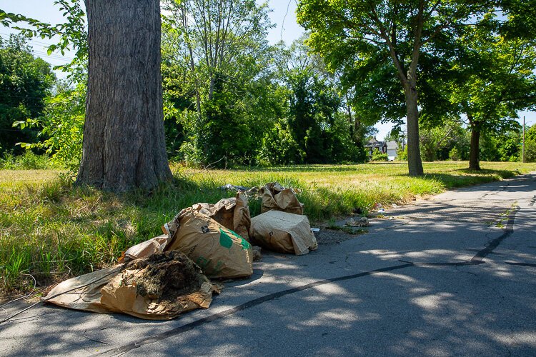 Trash left out on the street of Detroit East Side. 