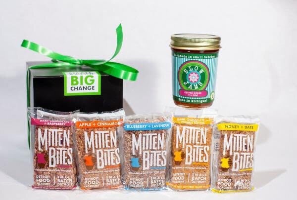 Each gift box contains five Mitten Bites, a nutritious snack bar, and a jar of Slow Jams, a brand of locally sourced jams and jellies. Custom combinations are available for larger orders.