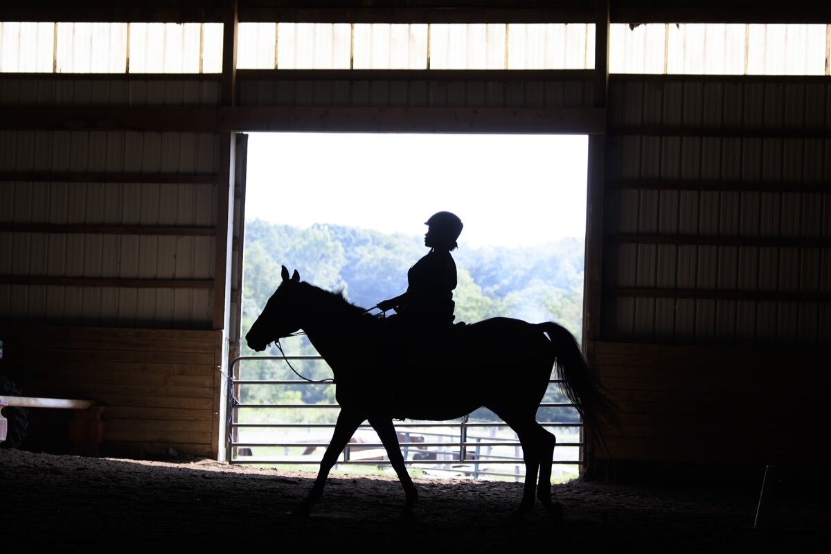 Azaria Lewis, 13, (8th grader) rides a horse named Nikon around the training ring at Willowbrooke Farm in Plymouth, Michigan.