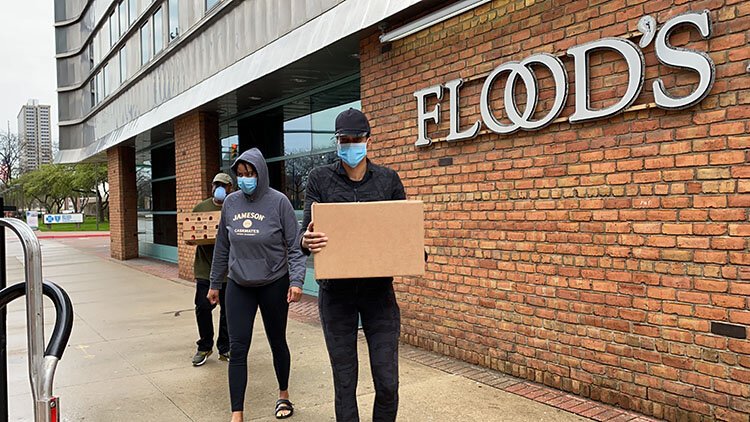 Stephanie Byrd and her sister, Cristina, take food to Detroit police officers.