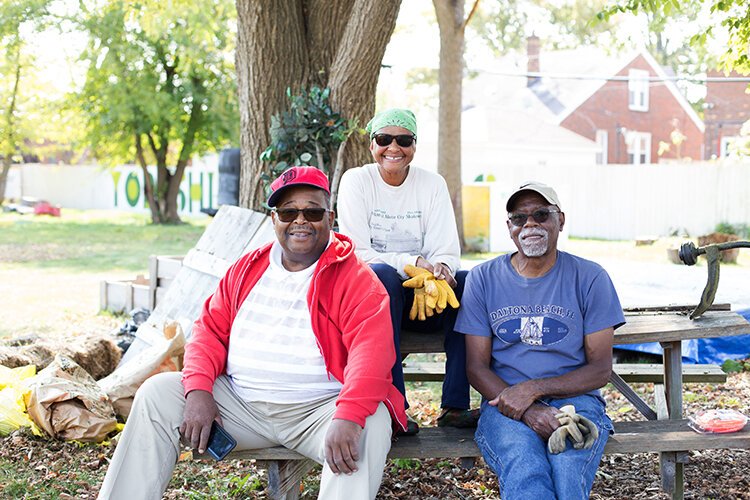 Mose Primus, Jaqueline Fulbright, and Emmitt Russell take a hard-earned break from their work on the Yorkshire Woods community gardens.