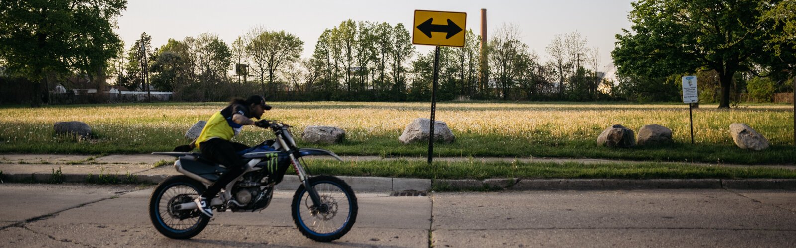 A motor cycle rider zips by Greenview-Wadsworth Park.