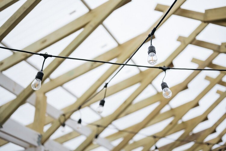Stylish rafters frame the stalls at the E. Warren Farmers Market.