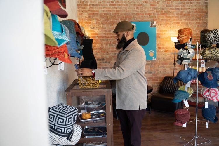 Ty Dickey looks over some of his shop's merchandise.