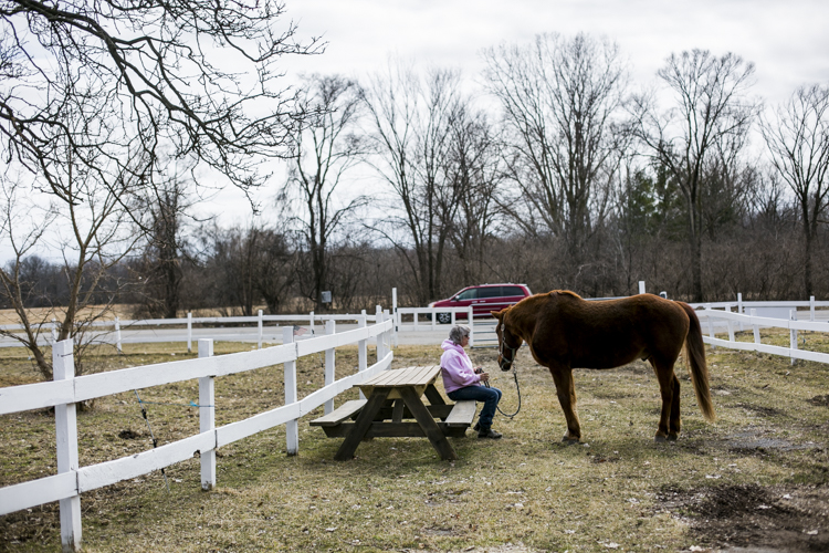 Edie Abramczyk sits with her horse.