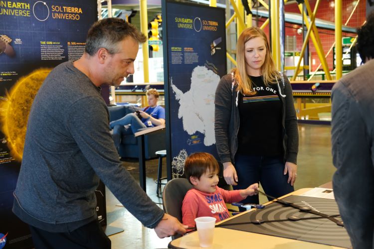 A young student learns about the solar system.