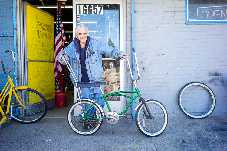 Sam Awada stands in front of Livernois Bike Shop.