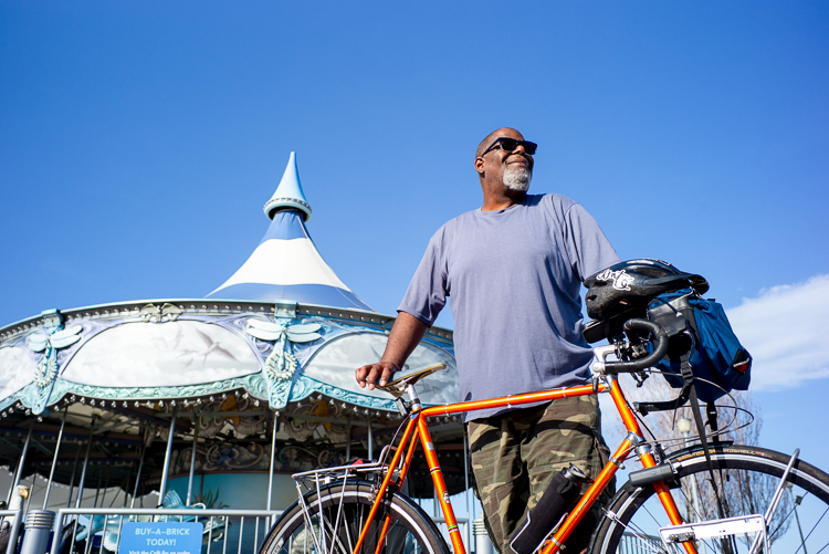 Henry Ford II enjoys the sun by a carousel near the Wheelhouse Detroit bike shop.