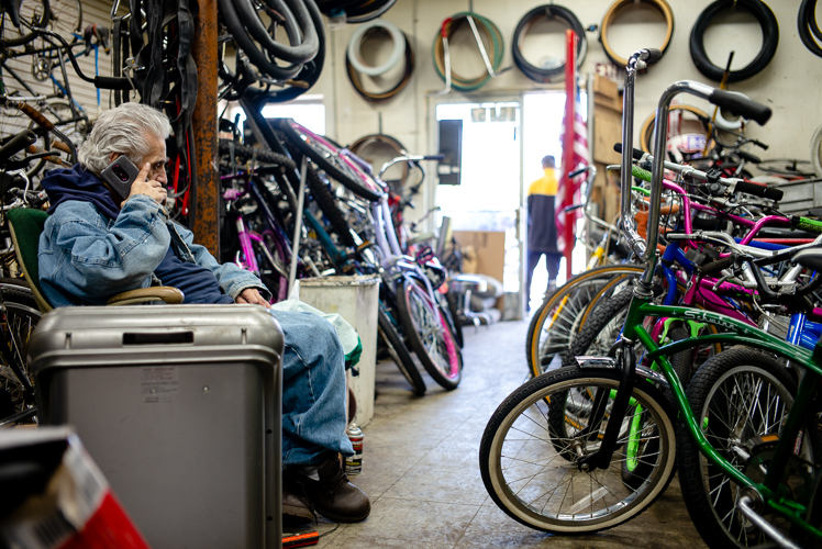 Sam Awada takes a phone call at Livernois Bike Shop.