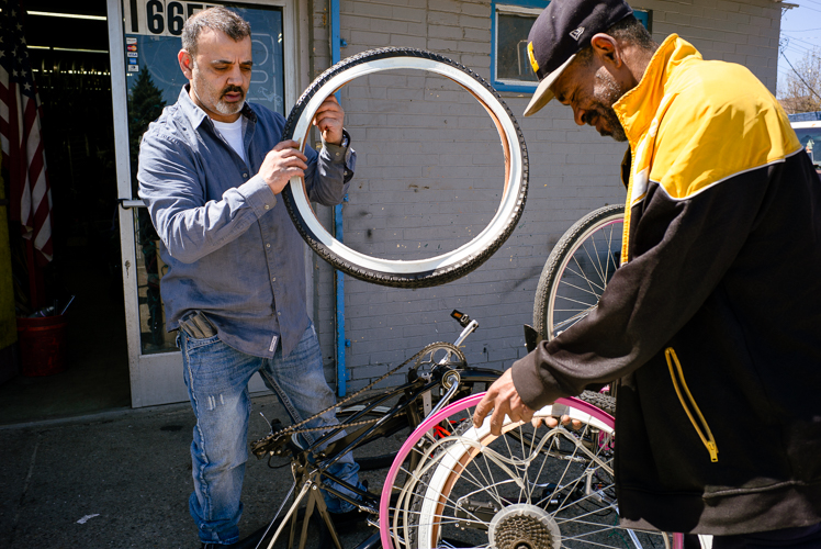 Looking at wheels at Livernois Bike Shop.