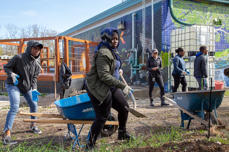 Volunteers get into the spirit duing a cleanup in Brightmoor.