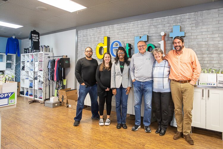 Larry Johnson and Marilyn Johnson (second and third from right) pose with LifeBUILDERS staff.